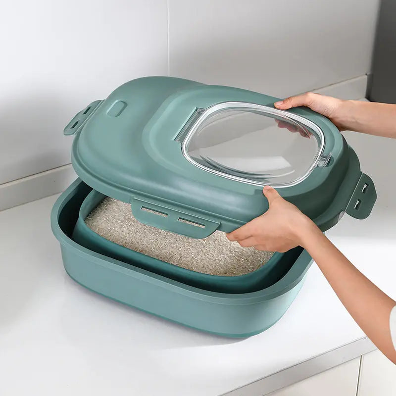 Green collapsible storage bin holding rice and dry grains